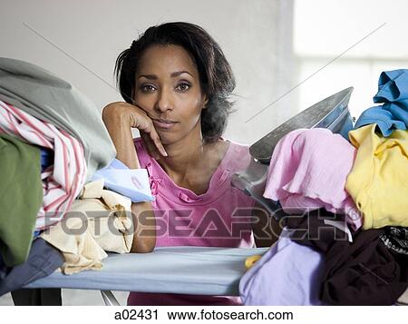 Orem, Utah, USA, mid adult woman ironing View Large Photo Image Stock Image - Orem, Utah, USA, mid adult woman ironing. Fotosearch