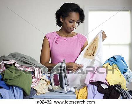 Orem, Utah, USA, mid adult woman holding burnt shirt View Large Photo Image Stock Image - Orem, Utah, USA, mid adult woman holding burnt shirt. Fotosearch