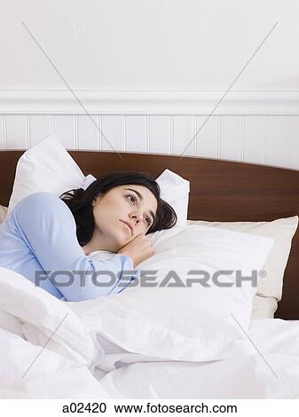 Orem, Utah, USA, young woman lying down in bed View Large Photo Image Stock Image - Orem, Utah, USA, young woman lying down in bed. Fotosearch