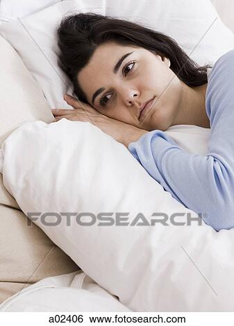 Orem, Utah, USA, young woman lying down in bed View Large Photo Image Stock Photograph - Orem, Utah, USA, young woman lying down in bed. Fotosearch