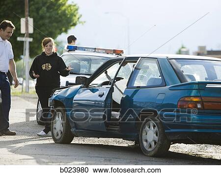 people looking at a car after an accident View Large Photo Image Stock Image - people looking at a car after an accident. Fotosearch