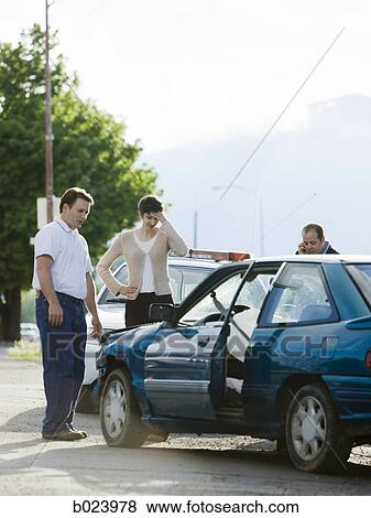 people looking at a car after an accident View Large Photo Image Stock Photo - people looking at a car after an accident. Fotosearch