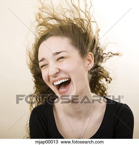 Stock Image - person getting wind blown in the face. Fotosearch