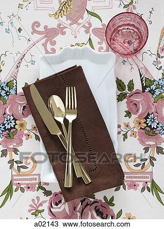 Plate with napkin and cutlery on floral tablecloth View Large Photo Image Stock Image - Plate with napkin and cutlery on floral tablecloth. Fotosearch