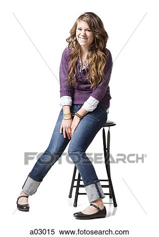 Portrait of cheerful teenage girl (16-17), studio shot View Large Photo Image Stock Photography - Portrait of cheerful teenage girl (16-17), studio shot. Fotosearch
