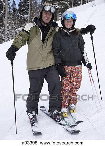 Portrait of father and daughter (12-13) skiing View Large Photo Image Stock Photo - Portrait of father and daughter (12-13) skiing. Fotosearch