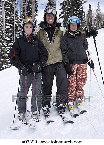 Portrait of father and daughter skiing View Large Photo Image Stock Photo - Portrait of father and daughter skiing. Fotosearch