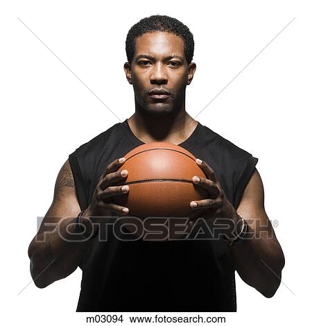 Portrait of male basketball player holding ball View Large Photo Image Picture - Portrait of male basketball player holding ball. Fotosearch