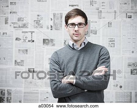 Portrait of man in room with walls covered with newspapers View Large Photo Image Picture - Portrait of man in room with walls covered with newspapers. Fotosearch