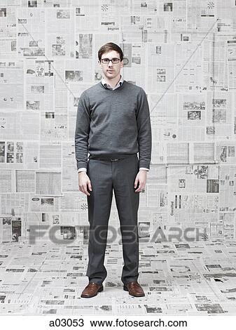 Portrait of man in room with walls covered with newspapers View Large Photo Image Stock Image - Portrait of man in room with walls covered with newspapers. Fotosearch
