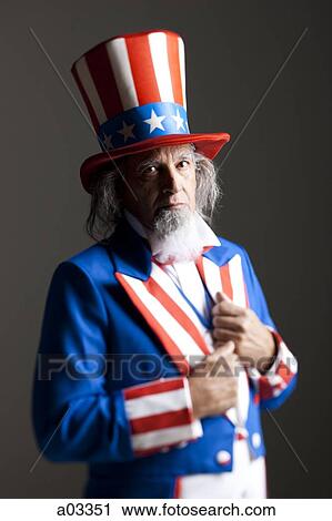 Stock Image - Portrait of man in Uncle Sam's costume, studio shot. Fotosearch