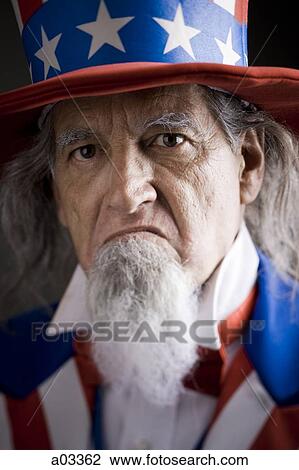 Stock Image - Portrait of man in Uncle Sam's costume, studio shot. Fotosearch