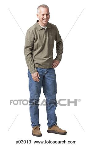 Stock Image - Portrait of mature man smiling, studio shot. Fotosearch