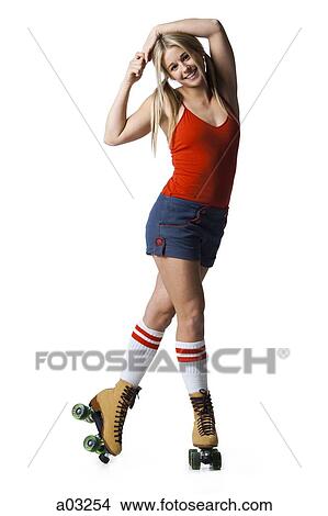 Portrait of young woman roller skating View Large Photo Image Picture - Portrait of young woman roller skating. Fotosearch