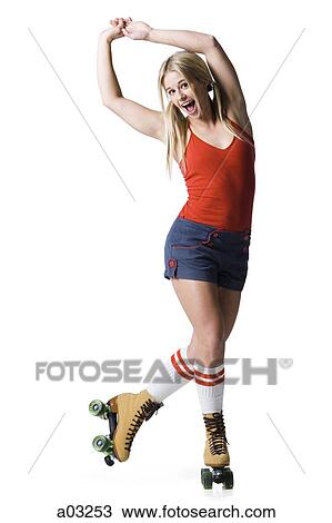 Portrait of young woman roller skating View Large Photo Image Stock Image - Portrait of young woman roller skating. Fotosearch