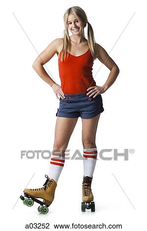Portrait of young woman wearing roller skates View Large Photo Image Stock Image - Portrait of young woman wearing roller skates. Fotosearch