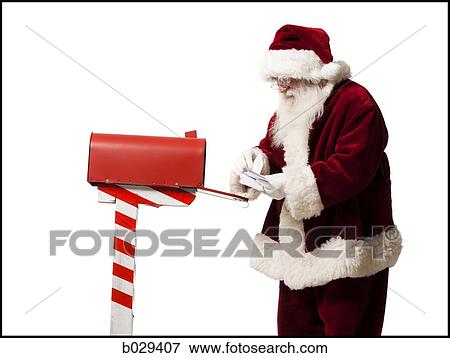 santa getting mail out of his mailbox View Large Photo Image Stock Photo - santa getting mail out of his mailbox. Fotosearch