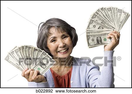 senior woman with hands full of dollars View Large Photo Image Stock Image - senior woman with hands full of dollars. Fotosearch