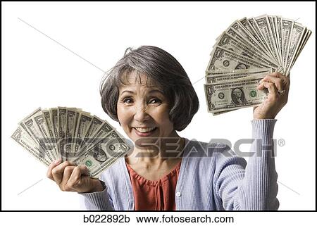 senior woman with hands full of dollars View Large Photo Image Stock Image - senior woman with hands full of dollars. Fotosearch