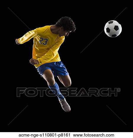 Stock Image - soccer player heading the ball. Fotosearch