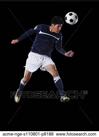 Soccer player heading the ball View Large Photo Image Stock Photo - Soccer player heading the ball. Fotosearch