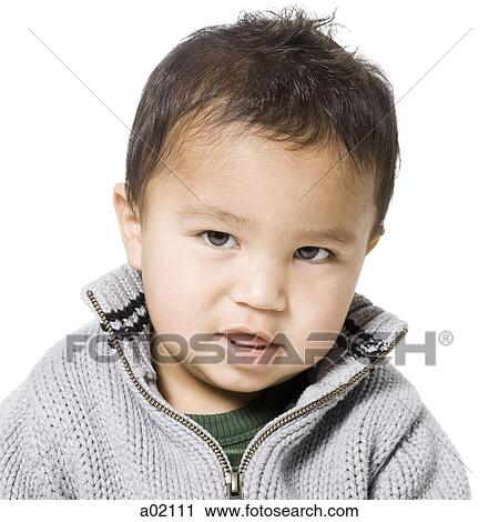 Stock Image - Studio portrait of baby boy (18-23 months). Fotosearch