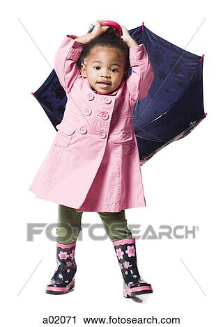 Studio portrait of baby girl (18-23 months) holding umbrella View Large Photo Image Stock Image - Studio portrait of baby girl (18-23 months) holding umbrella. Fotosearch