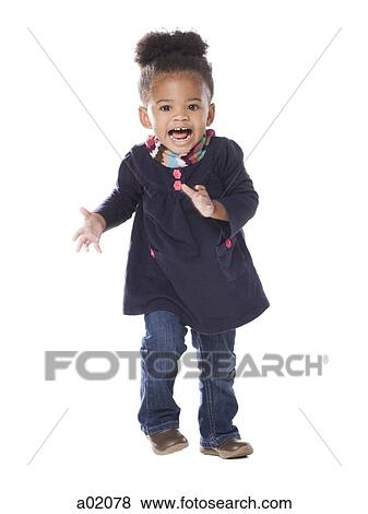 Studio portrait of baby girl (18-23 months) dancing View Large Photo Image Stock Photo - Studio portrait of baby girl (18-23 months) dancing. Fotosearch