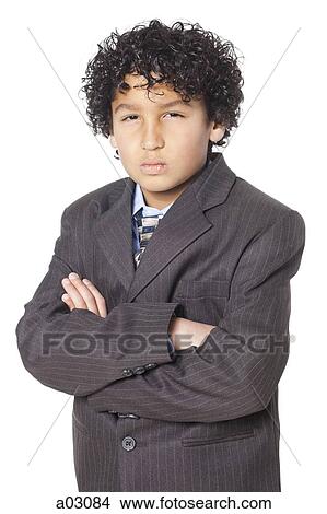 Studio portrait of boy (8-9) wearing suit View Large Photo Image Picture - Studio portrait of boy (8-9) wearing suit. Fotosearch
