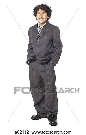 Studio portrait of boy (8-9) wearing suit View Large Photo Image Stock Image - Studio portrait of boy (8-9) wearing suit. Fotosearch