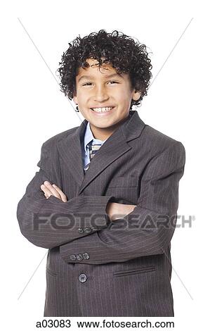Studio portrait of boy (8-9) wearing suit View Large Photo Image Stock Image - Studio portrait of boy (8-9) wearing suit. Fotosearch