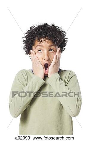 Studio portrait of boy (8-9) with head in hands View Large Photo Image Stock Photo - Studio portrait of boy (8-9) with head in hands. Fotosearch
