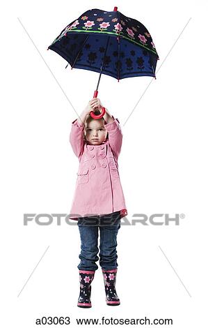 Studio portrait of girl (2-3) holding umbrella View Large Photo Image Stock Image - Studio portrait of girl (2-3) holding umbrella. Fotosearch