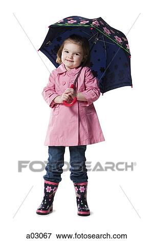 Studio portrait of girl (2-3) holding umbrella View Large Photo Image Stock Photo - Studio portrait of girl (2-3) holding umbrella. Fotosearch