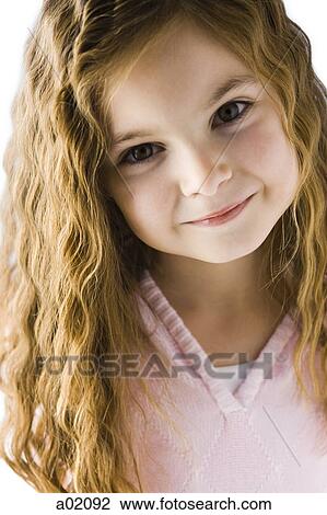 Studio portrait of girl (6-7) smiling View Large Photo Image Stock Image - Studio portrait of girl (6-7) smiling. Fotosearch