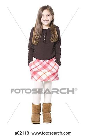 Studio portrait of girl (8-9) smiling View Large Photo Image Stock Photo - Studio portrait of girl (8-9) smiling. Fotosearch