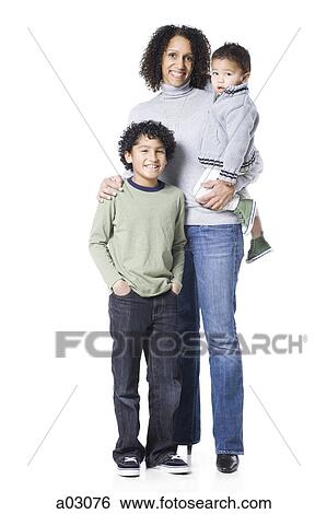 Studio portrait of mother with two sons (18-23 months, 8-9 years) View Large Photo Image Stock Photograph - Studio portrait of mother with two sons (18-23 months, 8-9 years). Fotosearch