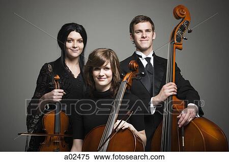 Studio portrait of three young musicians with instruments View Large Photo Image Stock Photography - Studio portrait of three young musicians with instruments. Fotosearch