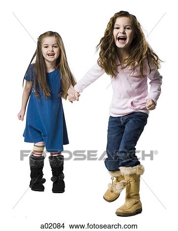 Picture - Studio portrait of two girls (4-7) holding hands. Fotosearch