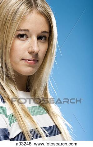 Studio portrait of young woman smiling View Large Photo Image Stock Photo - Studio portrait of young woman smiling. Fotosearch