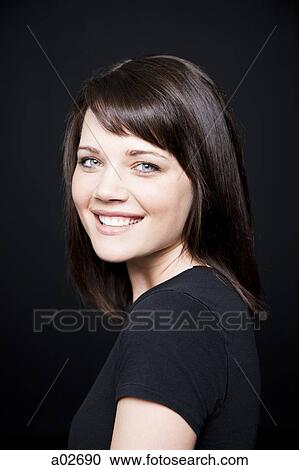 Studio portrait of young woman View Large Photo Image Stock Image - Studio portrait of young woman. Fotosearch