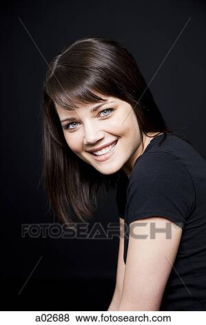 Stock Photo - Studio portrait of young woman. Fotosearch