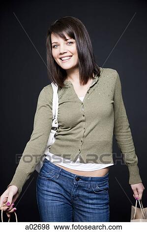 Stock Photo - Studio portrait of young woman. Fotosearch