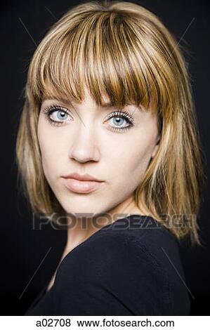 Studio portrait of young woman View Large Photo Image Stock Photo - Studio portrait of young woman. Fotosearch