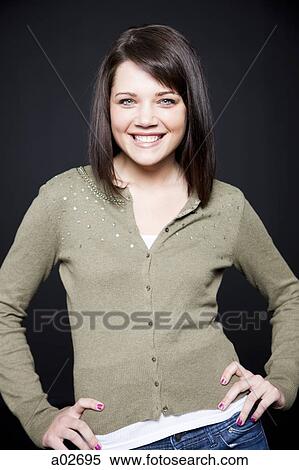 Stock Photography - Studio portrait of young woman. Fotosearch