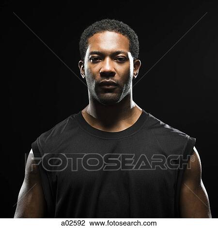 Studio shot of basketball player holding ball View Large Photo Image Stock Image - Studio shot of basketball player holding ball. Fotosearch