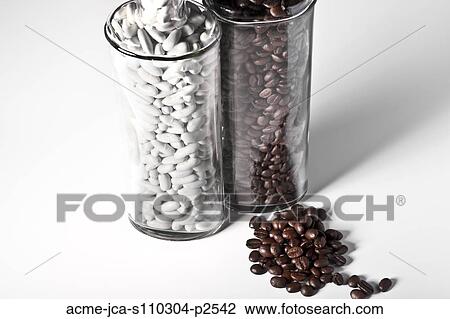 Studio shot of coffee and white beans in glass vases View Large Photo Image Stock Image - Studio shot of coffee and white beans in glass vases. Fotosearch