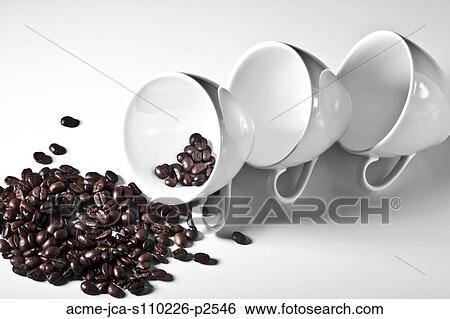 Studio shot of coffee cups and spilling coffee beans View Large Photo Image Stock Photograph - Studio shot of coffee cups and spilling coffee beans. Fotosearch