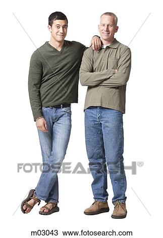 Stock Image - Studio shot of father and son. Fotosearch