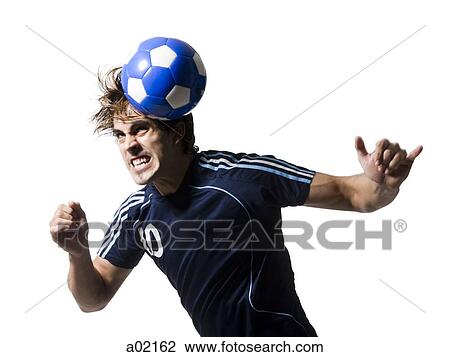 Stock Image - Studio shot of man hitting soccer ball with head. Fotosearch